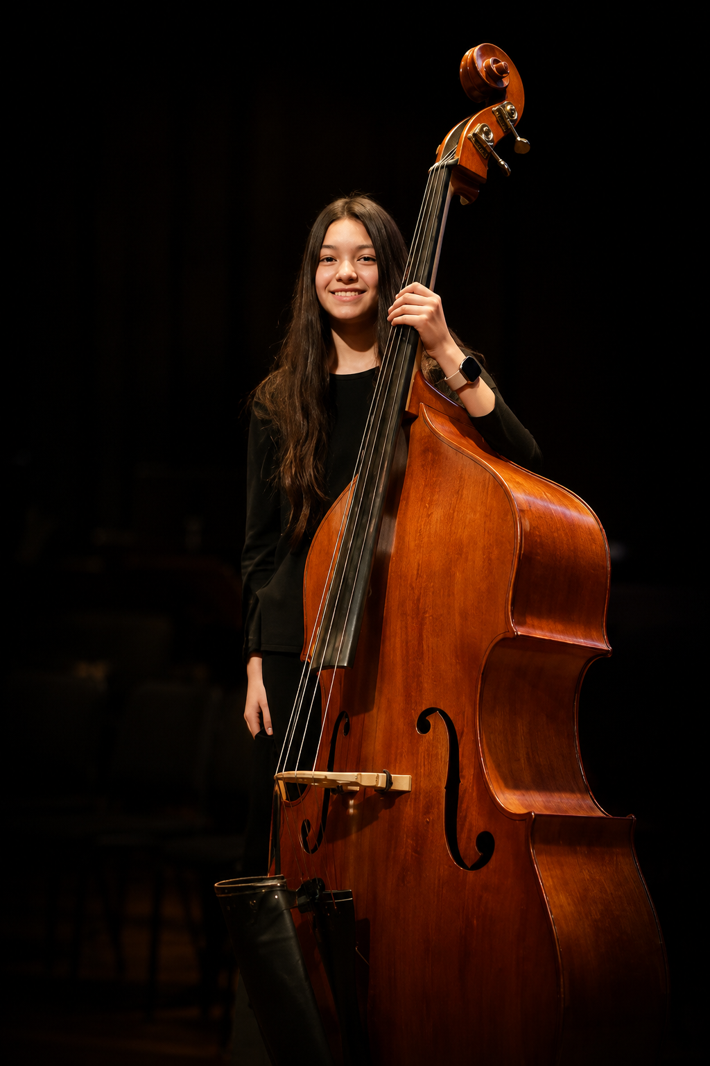 Kate Lin standing with a double bass